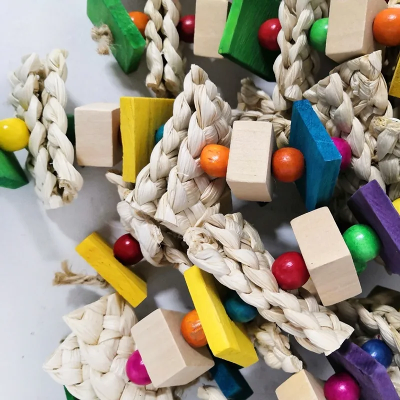 Parrots Gnaw On Toys Made Of Corn Husk And Wood